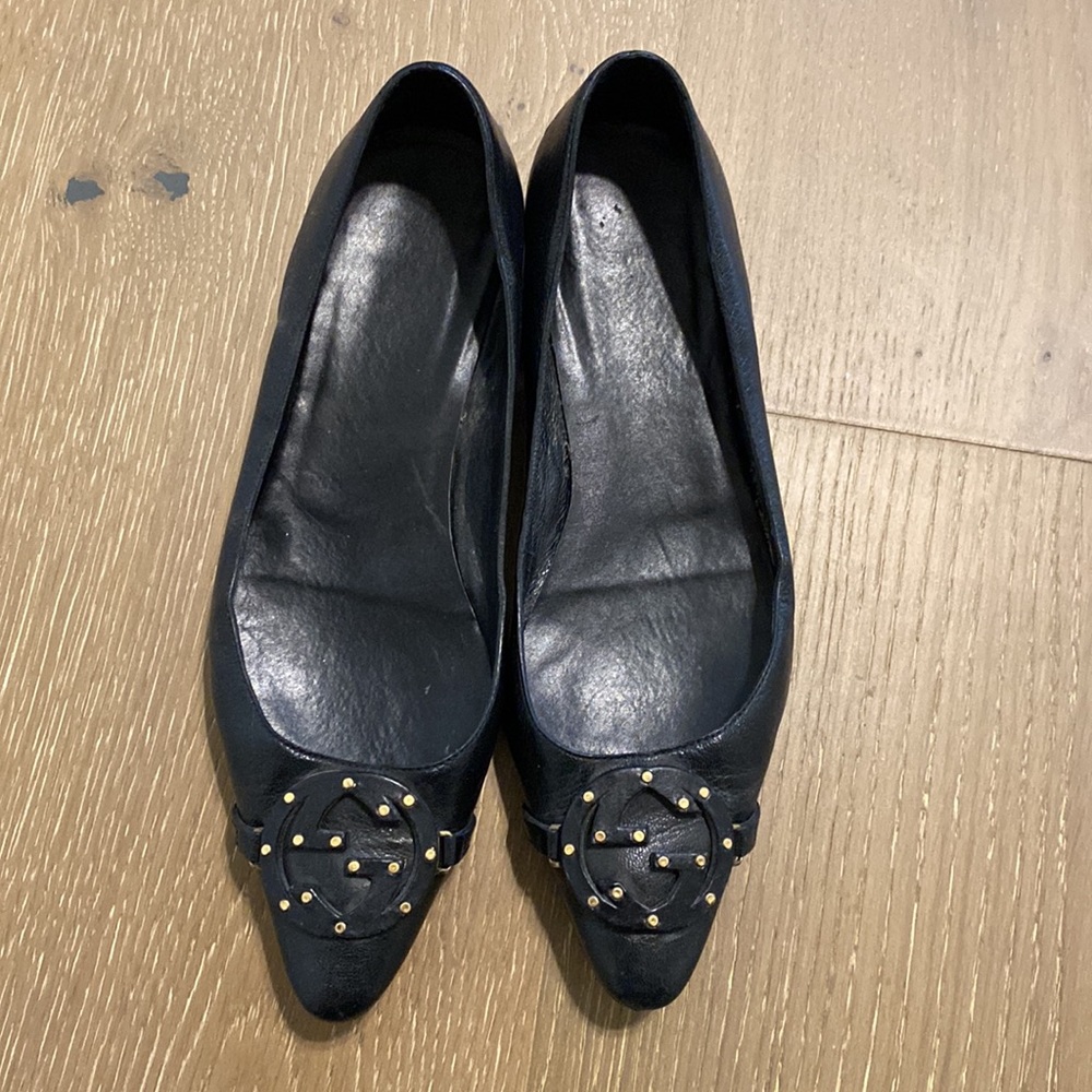 Gucci Black Leather Flats with Gold Accents